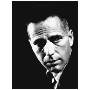 een zwart-witfoto van een man in een pak