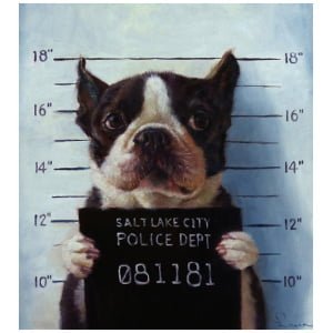 een hond die een bord vasthoudt met de tekst Salt Lake City Police Dept