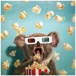 een koala die een 3D-bril draagt ​​terwijl hij popcorn eet